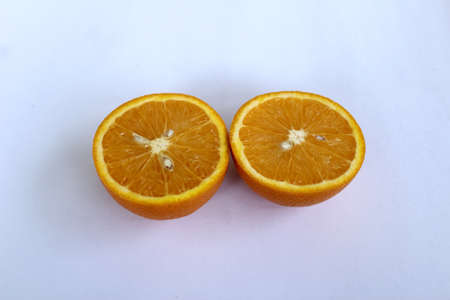 Orange fruit isolated on a white background. Close-up, selective focus.の写真素材