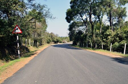 Road with Curve Sign Board Indiaの写真素材