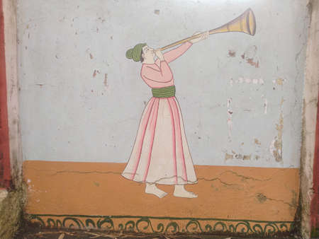 A Person Play Music instruments on Wall Indiaの写真素材