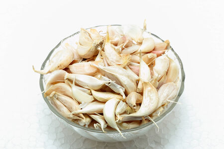 Garlic in a glass bowlの写真素材