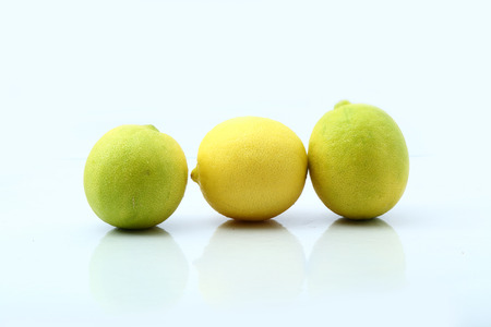 Fresh three lemons isolated on whiteの写真素材