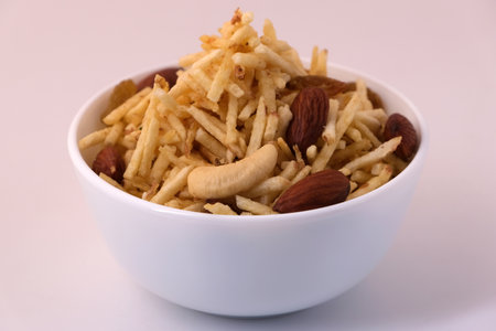 Indian style deep fried snacks falahari chivda- chivda or mixture namkeen with dry fruits.