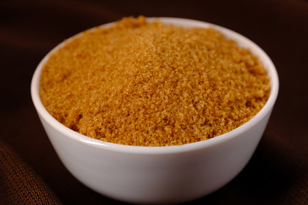Brown Sugar ceramic bowl on brown cloth texture backgroundの写真素材