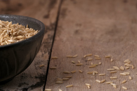 Raw brown rice in a bowlの写真素材