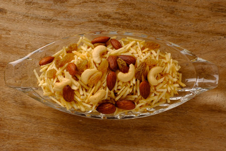 Indian style deep fried snacks falahari chivda- chivda or mixture namkeen with dry fruits.