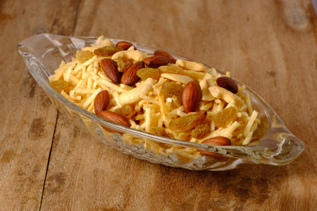 Indian style deep fried snacks falahari chivda- chivda or mixture namkeen with dry fruits.