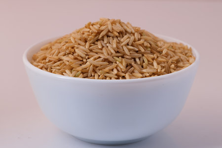 Raw brown rice in a bowlの写真素材