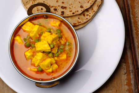 Indian style cottage cheese dish or curry with rotiの写真素材