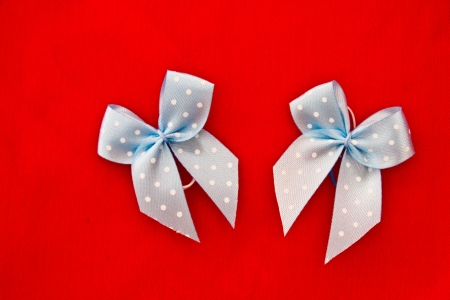 polka dot bow ribbons on red backgroundの写真素材