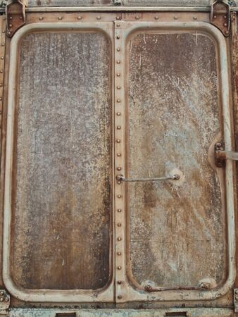 Very old iron door with rusty details