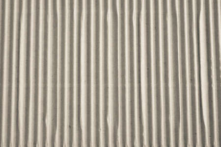 Textured corrugated striped cardboard with natural fiber parts の写真素材