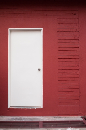 red house with white doorの写真素材
