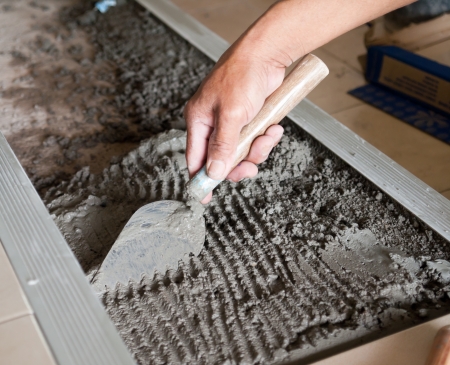 A construction worker using trowelの写真素材