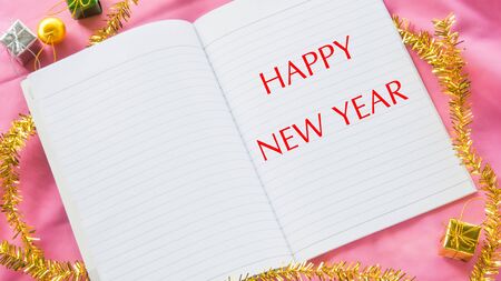 Word happy new year on notebookの写真素材