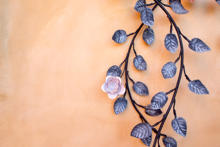 Orange background with steel roseの写真素材