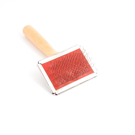 Brush for the grooming of dog fur isolated on white