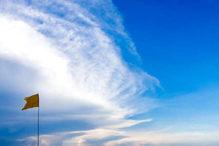 Blue sky with flagの写真素材