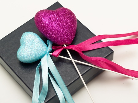 pink and blue hearts on a black gift boxの写真素材