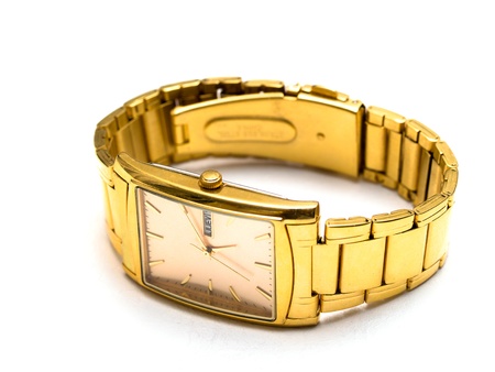 gold men's wristwatch on a white background
