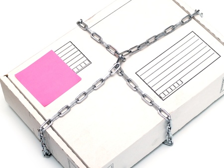 white parcel wrapped in a chain on whiteの写真素材