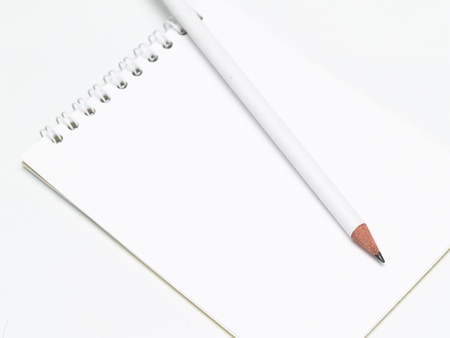 sharp white pencil on the notepadの写真素材