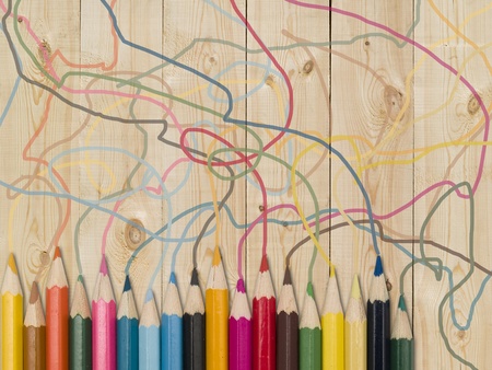 Colour pencils on a wooden plank