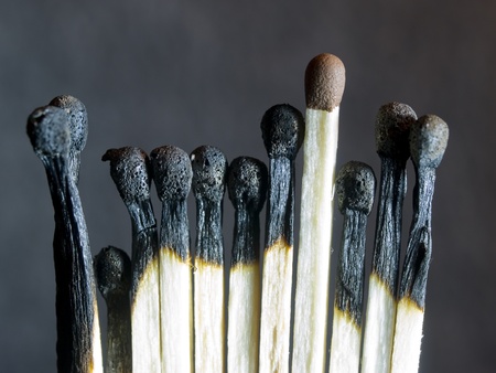 burnt matches and a whole match の写真素材