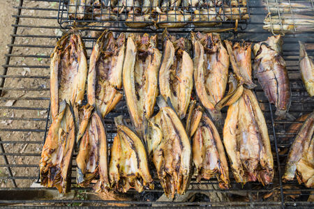 Grilling fish,fish preservation of countryside in thailand by fire and smoke.