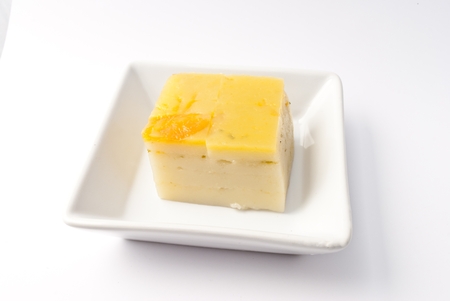 Coconut custard made from eggs and coconut milk,  in white bowl on white backgroundの写真素材