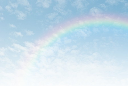 rainbow in the blue sky after the rainの写真素材