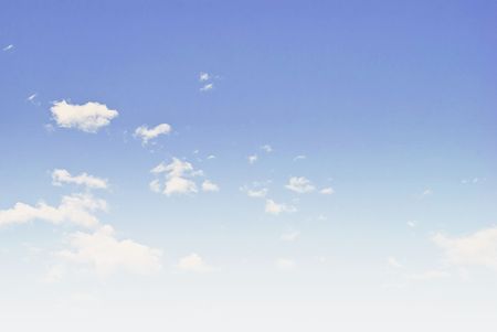 white fluffy clouds in the blue sky