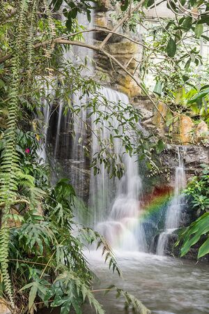 Wonderful Waterfall with rainbows in forest at North of Thailandの写真素材