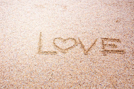 love message written in sand, Sign Love on sand on beachの写真素材