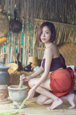 Portrait of asian woman thai traditional in Ancient Thai kitchen, beautiful thai woman in thai costume, beautiful asian womanの写真素材