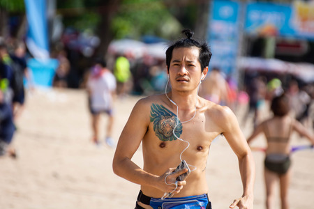 Pattaya, Thailand - May 19, 2018 - Young men and young girls competing in the most sexy outfits on the beach of Pattaya, at Pattaya Bikini Beach Race 2018 at Central Festival Pattaya beachのeditorial素材
