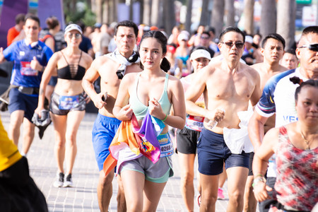 Pattaya, Thailand - May 19, 2018 - Young men and young girls competing in the most sexy outfits on the beach of Pattaya, at Pattaya Bikini Beach Race 2018 at Central Festival Pattaya beachのeditorial素材
