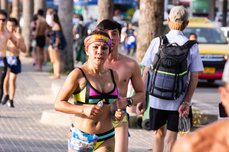 Pattaya, Thailand - May 19, 2018 - Young men and young girls competing in the most sexy outfits on the beach of Pattaya, at Pattaya Bikini Beach Race 2018 at Central Festival Pattaya beachのeditorial素材