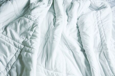 Wrinkle Messy Blanket In Bedroom After Waking Up In The Morning, From Sleeping In A Long Night, Details Of Duvet And Blanket, An Unmade Bed In Hotel Bedroom With White Blanket.の写真素材