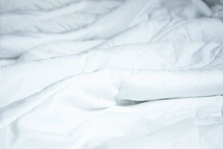 Top View Of White Blanket That Wrinkles On The Bed After Sleep In A Long Night.の写真素材