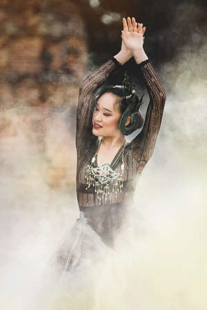 Asian Women Dressed In Fashion Thai Traditions, In Ancient Places And Refreshing Nature.
