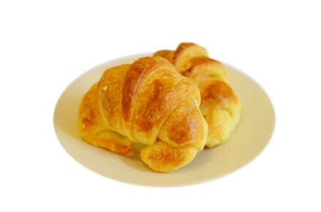 two fresh croissant ,casting soft whadow on white. の写真素材