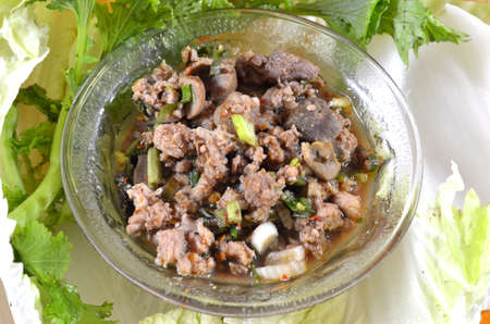 Thai dish of spicy minced pork eaten with vegetableの写真素材