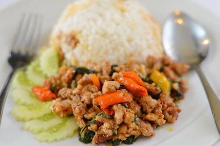 Rice and  minced pork fried with chilli pepper and  sweet basil の写真素材