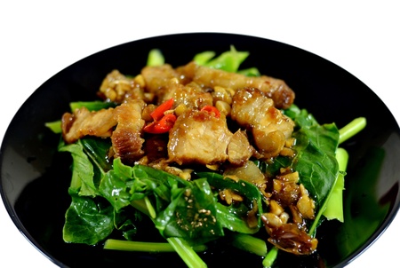 Thai stir fried chinese kale with crispy porkの写真素材