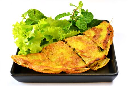 Vietnamese stuffed crispy omelette served with fresh vegetableの写真素材