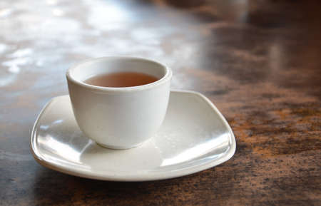 a cup of hot tea on tableの写真素材