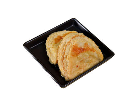 Puff pastry with tuna on the plate , white backgroundの写真素材