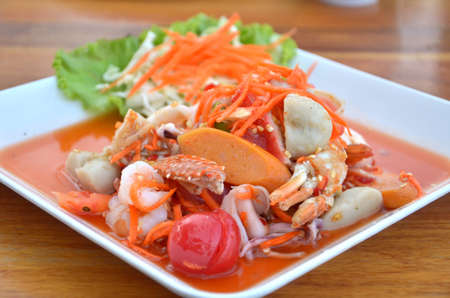 Thai cuisine ,  spicy seafood salad on wooden tableの写真素材