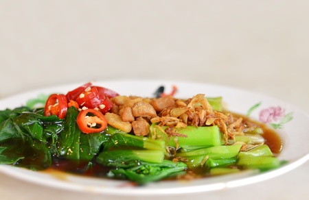 kale fried with oyster sauce  , topped with fried onion and red chili  の写真素材