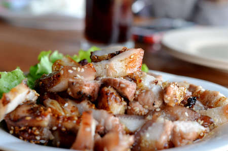 a delicious sliced grilled pork  served with vegetablesの写真素材